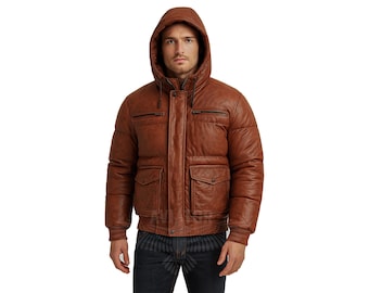 May include: A brown leather jacket with a hood. The jacket has a quilted design, two chest pockets, and two lower pockets. The model is wearing blue jeans. The jacket is a medium brown color.