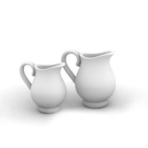 May include: Two white ceramic pitchers, one larger than the other, with a classic design. The pitchers have a rounded body and a small spout.