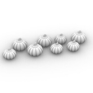 May include: A row of nine white ceramic pumpkins of varying sizes, arranged in a staggered pattern on a white background.