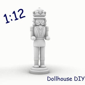 May include: A white, 1:12 scale, plastic nutcracker figurine. The nutcracker is wearing a crown and has a moustache and beard. The figurine is standing on a base.