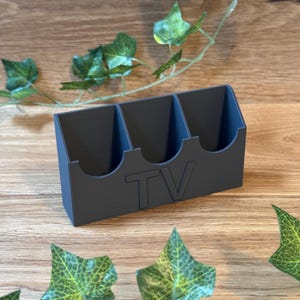 TV remote wall mount | Universal holder for remote controls | Organizer for Apple TV remote, Samsung remote, Fire TV remote and much more.