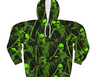 May include: A black hoodie featuring a green skeleton pattern. The skeletons are in various poses, some with their arms raised and some with their arms down. The hoodie has a drawstring hood and a kangaroo pocket.