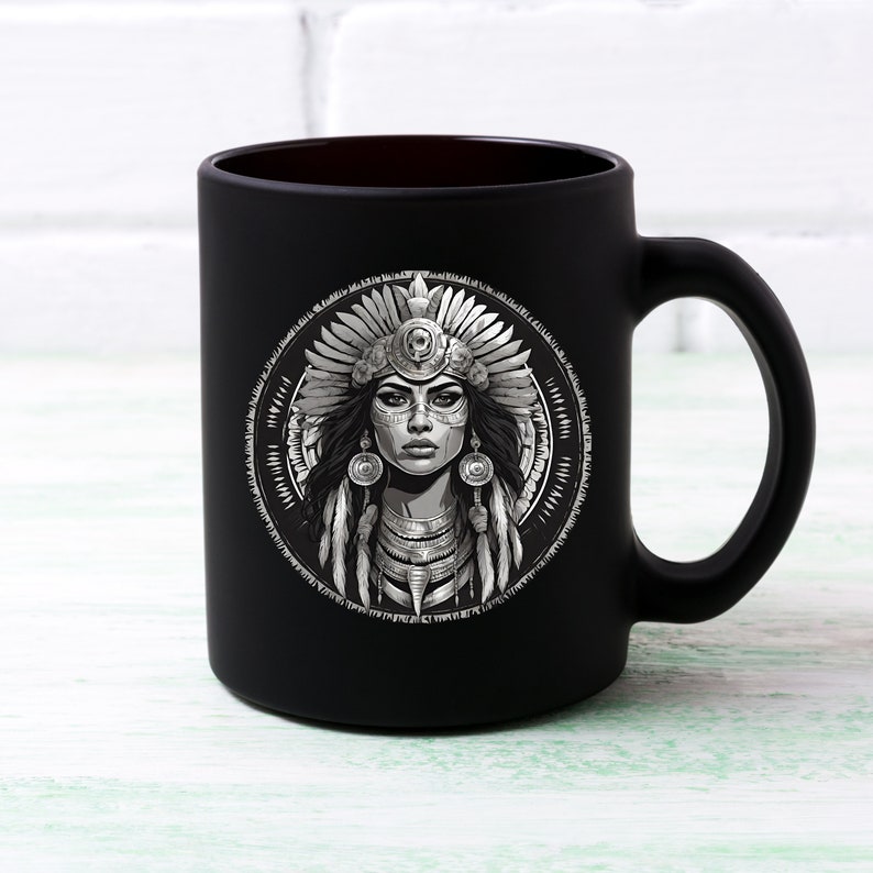 May include: Black ceramic mug with a white graphic of a Native American woman wearing a headdress and jewelry.