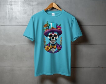May include: A turquoise blue t-shirt with a colorful skull wearing a top hat and bow tie. The skull has a sugar skull design with flowers and leaves around it.