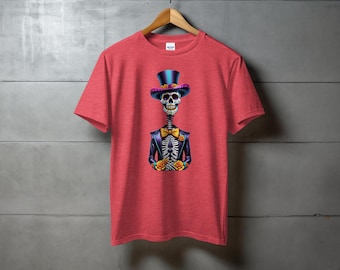 May include: Red t-shirt with a colorful skeleton wearing a top hat and bow tie. The skeleton is holding marigolds in its hands.