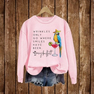 Wrinkles Only Go Where Smiles Have Been Sweatshirt, Jimmy Buffett Memorial Parrot T-Shirt, Jimmy Buffett Long-Sleeve, Best Gift For Fan