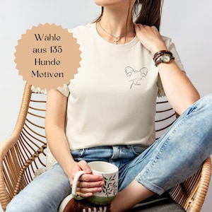 May include: A white ceramic mug with a black handle and the text "But First, Coffee" in a bold, black font. The mug is set against a neutral background, highlighting its simple design.