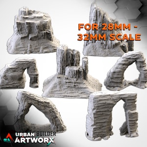 Peut inclure: Ensemble de cinq formations rocheuses en résine grise à l'échelle 28 mm à 32 mm pour les jeux de table. L'ensemble comprend une formation rocheuse haute, une arche rocheuse et trois formations rocheuses plus petites.