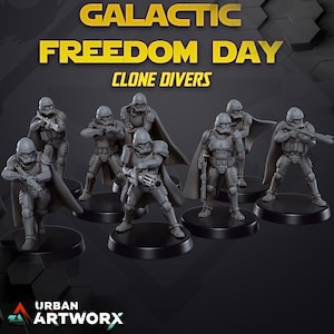 May include: A set of six gray plastic miniature figures of Star Wars Clone Troopers, each with a different weapon and pose. The figures are standing on black bases and are labeled "Clone Divers". The text "Galactic Freedom Day" is displayed above the figures.