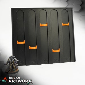 May include: Black plastic storage rack with five compartments, each with three orange slots. The rack is labeled "25" at the bottom of each compartment.