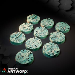 May include: A set of nine circular miniature bases featuring a raised mechanical design with intricate gears, cogs, and pipes. The bases are colored in a light teal hue with subtle shading, displaying a complex industrial texture across each surface.
