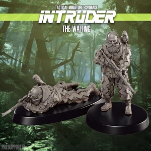May include: Two miniature figurines of soldiers in camouflage, one prone and one standing, holding rifles. The figurines are on black bases. The text "INTRUDER THE WAITING" is at the top. The background is a blurred forest scene.