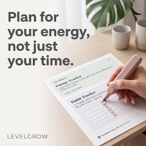 May include: A white paper planner page titled The Gentle Focus Tool ADHD Planner with sections for Energy Tracker and Habit Tracker. The text Plan for your energy, not just your time is visible. A pink marker is used to fill in a habit tracker box.