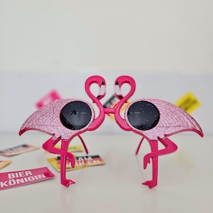Flamingo-Sonnenbrille – Glitzer Partyspaß mit tropischem Flair