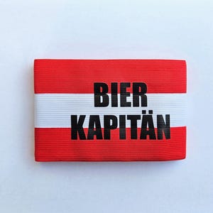 Bier Kapitän Österreich Armband Armbinde für Malle Urlaub, Oktoberfest und andere Saufpartys für starke Arme! (Party Armband Malle)