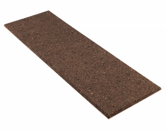 May include: A brown cork board with a rough texture.