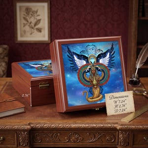 May include: A square wooden keepsake box with a hinged lid featuring a colorful illustration of a winged figure with a snake tail holding a vessel against a blue starry background. The box measures 7.24 inches wide, 2.76 inches high, and 7.24 inches deep.