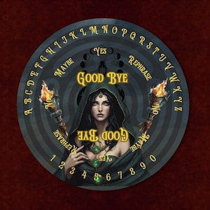 May include: A circular spirit board featuring a central illustration of a dark-haired figure in a hooded cloak holding two flaming torches. The board includes the alphabet, numbers zero through nine, and the words YES, NO, MAYBE, REPHRASE, and GOOD BYE.