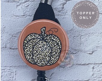 Topper de carrete de insignia de calabaza de leopardo