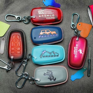 All Bronco Leather Key Fob Cover – Fits Big Bend, Outer Banks, Badlands, Heritage, Sasquatch | Custom Bronco G.O.A.T. Keychain & Logo Colors