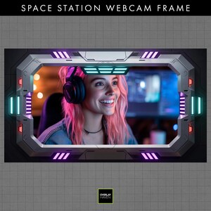May include: A space station-themed webcam frame, with the text "SPACE STATION WEBCAM FRAME." The frame features neon blue, purple, and red lights. The frame surrounds a person wearing headphones. The Overlay Haven logo is visible.