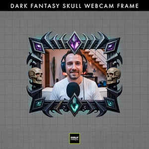 May include: Dark fantasy skull webcam frame with the text "DARK FANTASY SKULL WEBCAM FRAME". The frame is black and gray with purple and teal accents. Two skulls are on the sides. The frame has a diamond shape in the center and corners.