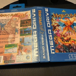 May include: A blue Sega Mega Drive game cartridge for Hercules Part 2. The front of the cartridge features a colourful illustration of Hercules, Megara, and Hades from the Disney film.