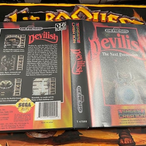 May include: A Sega Genesis game cartridge for the game "Devilish: The Next Possession" by Sage's Creation. The cartridge is black with red and white text. The back of the cartridge has a description of the game and a Sega logo.