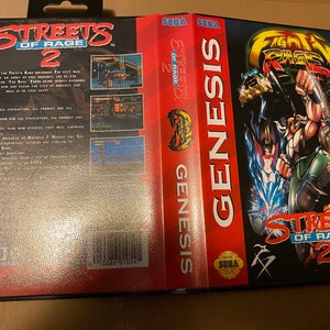 May include: A Sega Genesis video game cartridge for Streets of Rage 2. The front of the cartridge features a red, black, and white illustration of a character from the game. The back of the cartridge has a black background with white text and a few screenshots of the game.