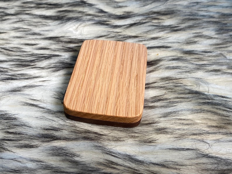 May include: A rustic wooden sign with the text "Welcome to our home" in white lettering. The sign features a distressed finish and a simple, inviting design, perfect for a front porch or entryway.