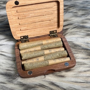 May include: A rustic wooden sign with the text "Welcome to our home" in a handwritten style. The sign is rectangular, with a distressed finish, and features a simple, inviting design. It's suitable for indoor or outdoor use.