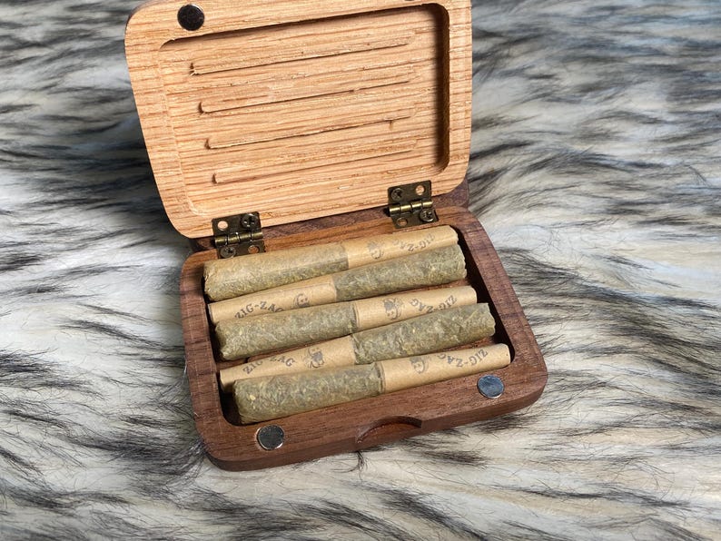 May include: A rustic wooden sign with the text "Welcome to our home" in a handwritten style. The sign is rectangular, with a distressed finish, and features a simple, inviting design. It's suitable for indoor or outdoor use.