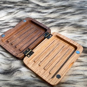 May include: A white ceramic mug with a black handle and the text "But First, Coffee" in a black, bold font. The mug is on a white surface. The mug is approximately 4 inches tall.