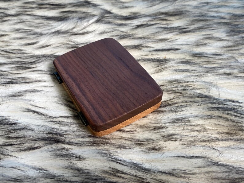 May include: A set of three ceramic mugs with a speckled, matte finish. The mugs are in shades of cream, light gray, and dark gray. Each mug has a simple, minimalist design, perfect for coffee or tea.