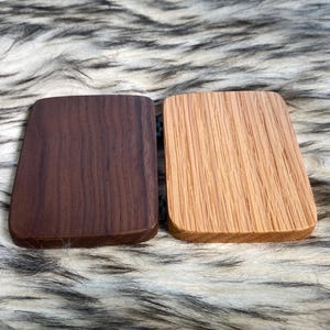 May include: A set of three ceramic mugs with a speckled, matte finish. The mugs are in shades of cream, light gray, and dark gray. Each mug has a simple, minimalist design, perfect for coffee or tea.