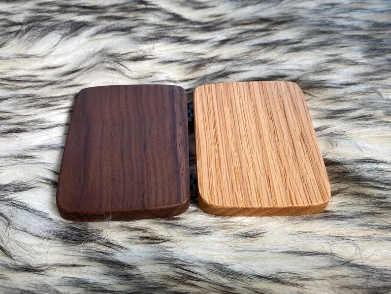 May include: A set of three ceramic mugs with a speckled, matte finish. The mugs are in shades of cream, light gray, and dark gray. Each mug has a simple, minimalist design, perfect for coffee or tea.