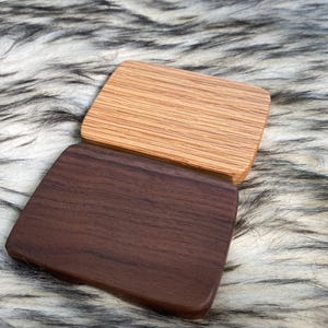 May include: A rustic wooden sign with the text "Welcome to our home" in a handwritten style. The sign features a distressed finish and a simple, inviting design, perfect for a front porch or entryway.