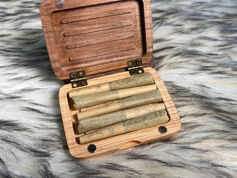 May include: A rustic wooden sign with the text "Welcome to our home" in white lettering. The sign features a distressed finish and a simple, inviting design, perfect for a front porch or entryway.