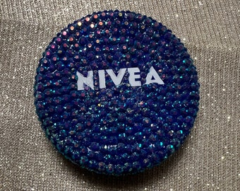 Blinged and bedazzled Nivea cream .