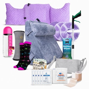 May include: A recovery kit featuring a purple textured pillow, a gray wedge pillow, a pink and clear water bottle with a pill organizer, black socks with heart-rate patterns, two purple gel packs, bathing wipes, Arnica tea, gauze pads, and a gray sling.