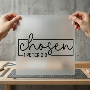 May include: A translucent sheet with the word "chosen" in a black, cursive font, enclosed in a black rectangular box. Below the word is the text "1 PETER 2:9" in a smaller, block font. The sheet is held up by two hands.