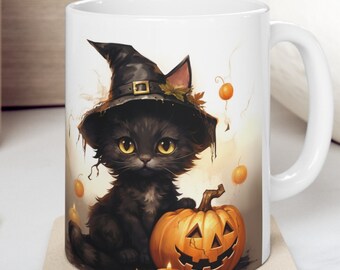 May include: White ceramic mug with a black cat wearing a witch's hat and holding a jack-o'-lantern. The cat has yellow eyes and a black nose. The mug is on a beige coaster.