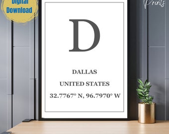 May include: A framed print featuring the letter "D" in a dark grey font, with the city name "Dallas" and coordinates. The words "Digital Download" are in a circle in the upper left corner. The words "Steel Blue Prints" are in the upper right corner.