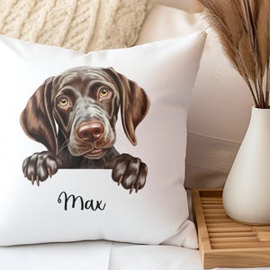 May include: White throw pillow with a brown and black dog peeking over the top. The dog's name, "Max", is written in black cursive below the dog.
