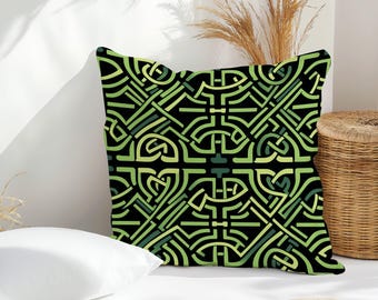 May include: Square throw pillow with a black background and a repeating geometric pattern in shades of green. The design features interwoven lines and shapes, creating a complex, symmetrical design. The pillow is placed on a white surface.