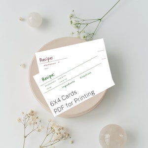 May include: Two printable recipe cards with green and brown text. The cards are 6x4 inches and are designed for printing. The text on the cards includes "Recipe", "Prepping Time", "Cooking Time", "Servings", "Ingredients", and "Directions".