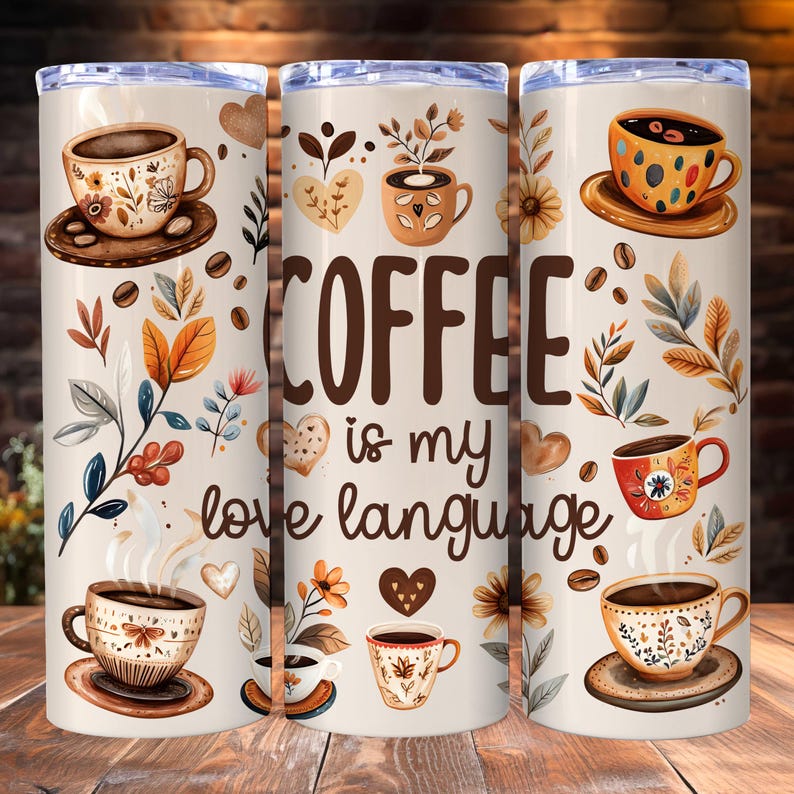 May include: A white tumbler with a brown, black, and orange floral design. The tumbler features the text "COFFEE is my love language".