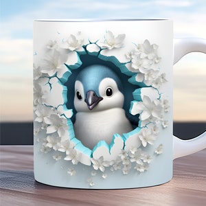 May include: A white ceramic mug featuring a blue and white penguin peeking out of a hole surrounded by white flowers. The mug has a light blue background.