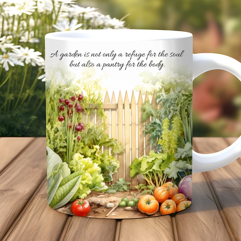 May include: White ceramic mug with a garden scene and the quote "A garden is not only a refuge for the soul but also a pantry for the body."