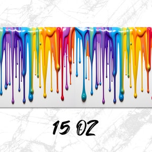May include: A colorful rainbow paint drip design on a white background. The paint drips are in the colors of the rainbow, from red to violet. The text "15 OZ" is printed below the design.